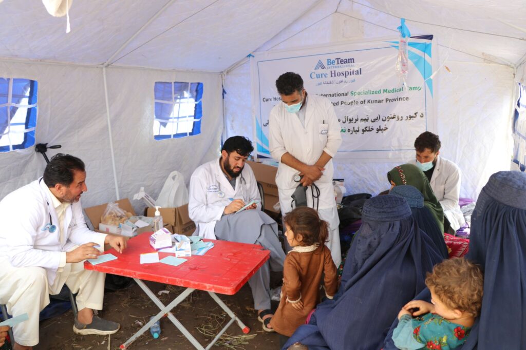Be Team International Cure Hospital medical team treating women and children inside a temporary tent during a crisis response medical camp in Afghanistan