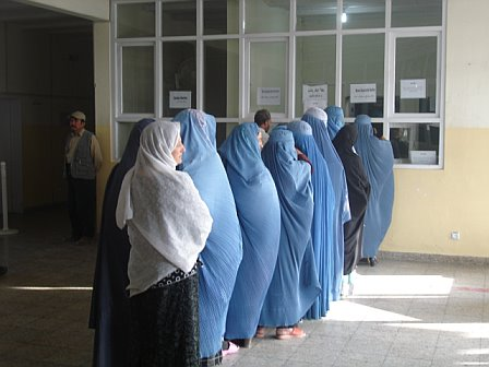 Afghan women in burqas waiting in line for medical treatment at Be Team International's Cure Hospital in Kabul, Afghanistan